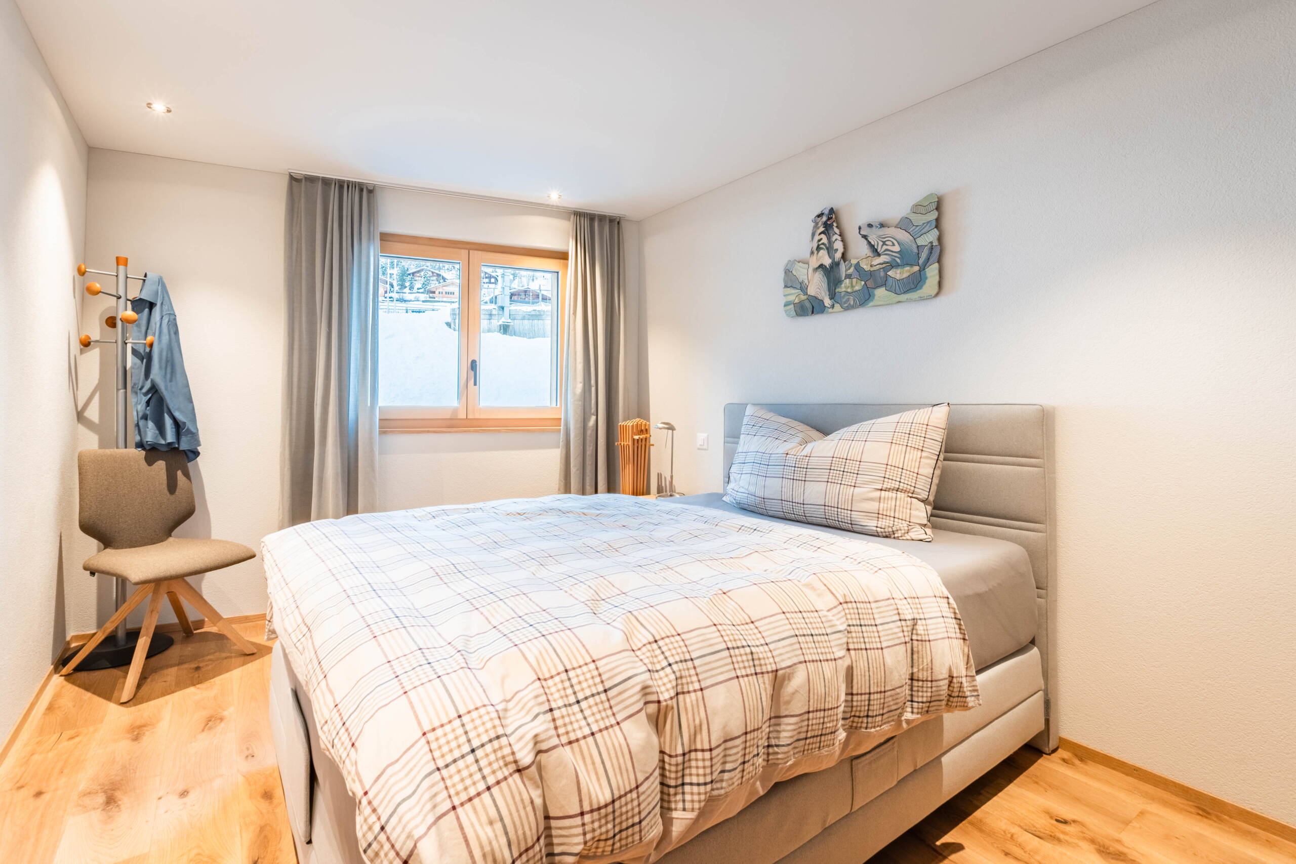 Bedroom in Chalet WALT - furnished in a modern alpine style.