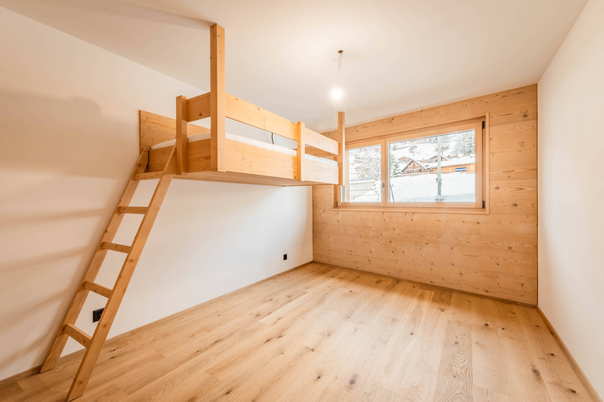 Bedroom in Chalet WALT with panoramic windows and a light-flooded atmosphere